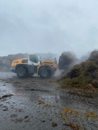 Wheel loader high tip bucket